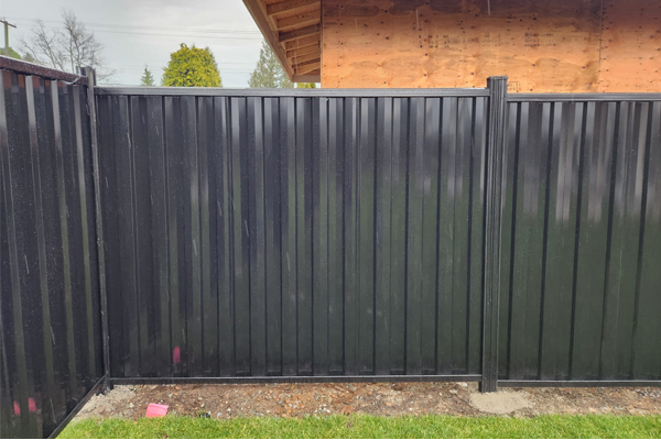Corrugated steel fence