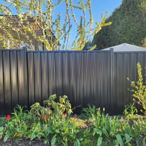 Corrugated steel fence