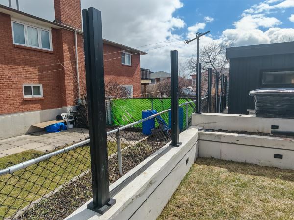 Heavy-duty WPC fence post base plate installation on concrete footing
